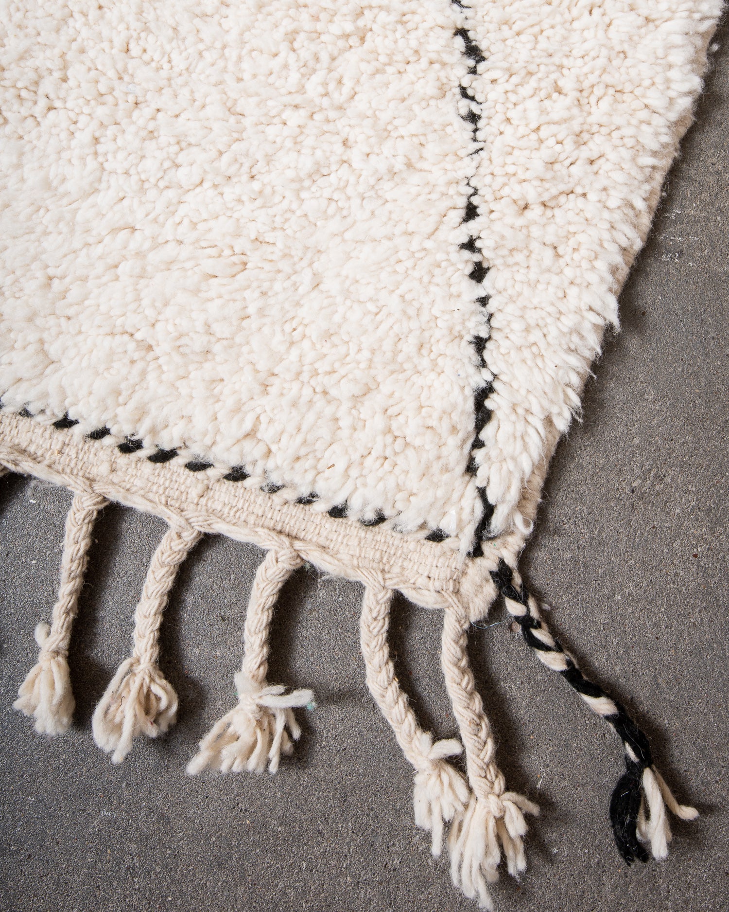 Modern, designer, handcrafted Berber rug from Morocco. Beniourain carpet with minimalist design, natural wool pile and a fluffy texture.